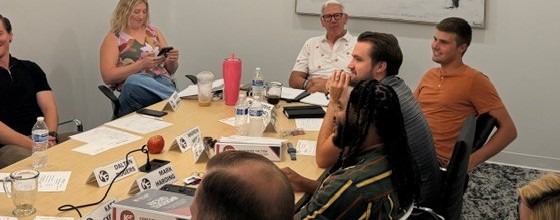 An Ascend Leadership cohort meeting around the table
